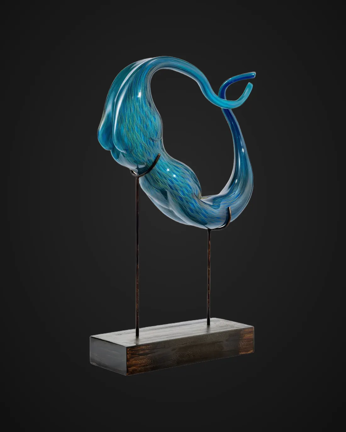Glass sculpture by Alexis Silk: blue figure on a stand