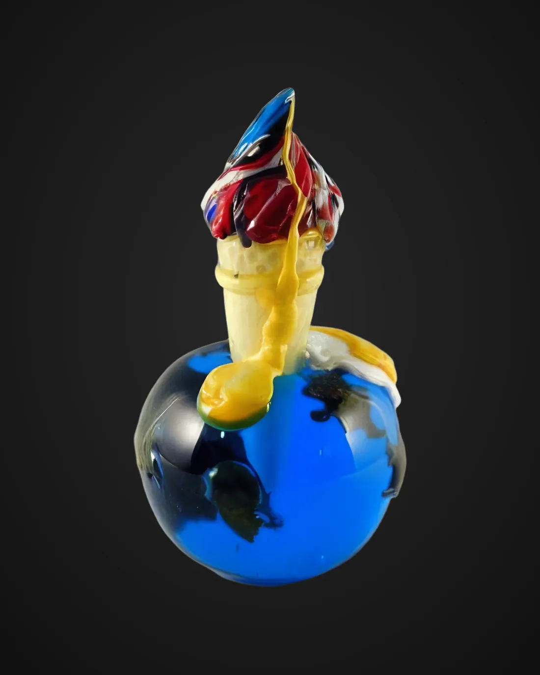 Glass sculpture by Vania Galli: blue sphere with coloured flame